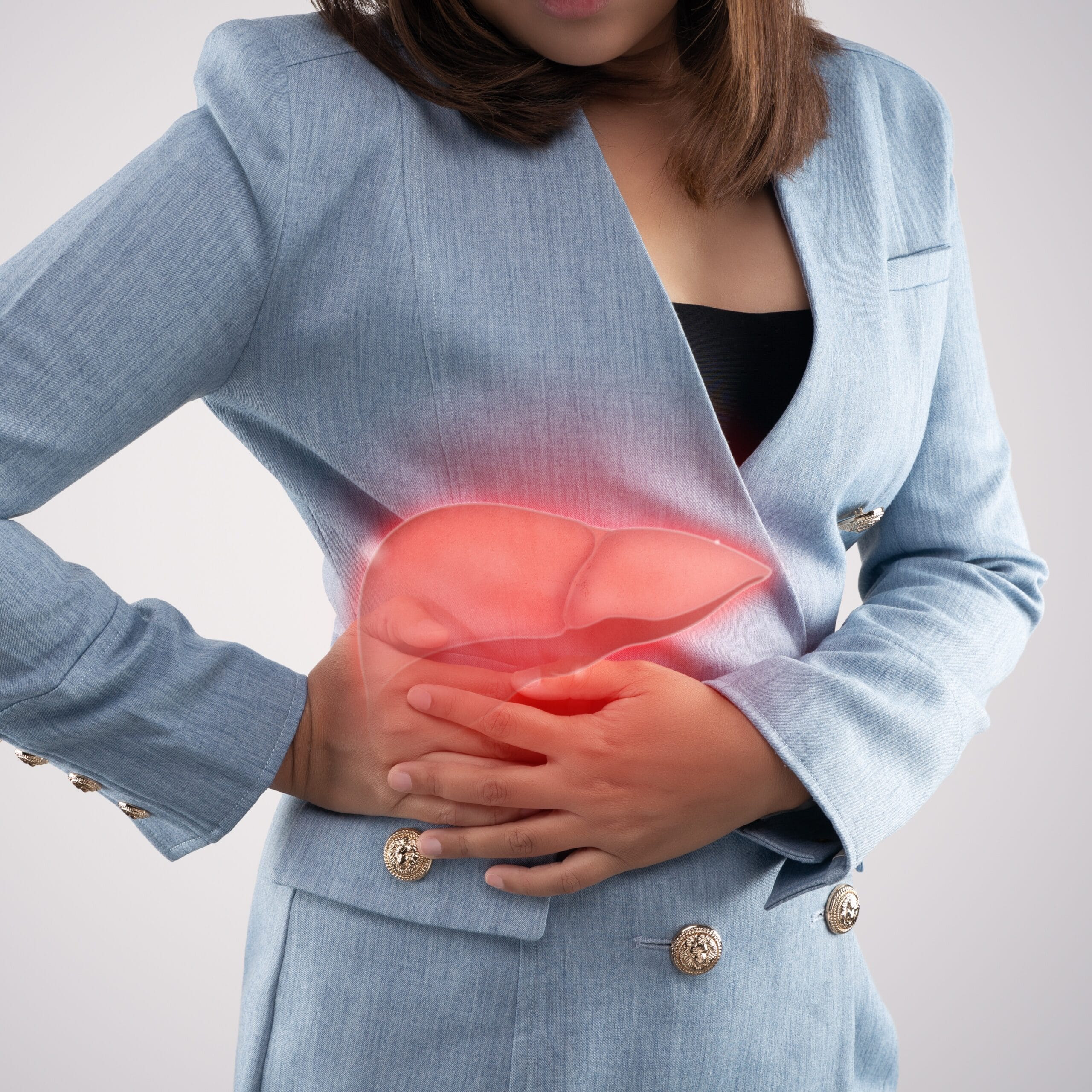 The photo of liver on woman's body against gray background, Hepatitis, Concept with healthcare and medicine.