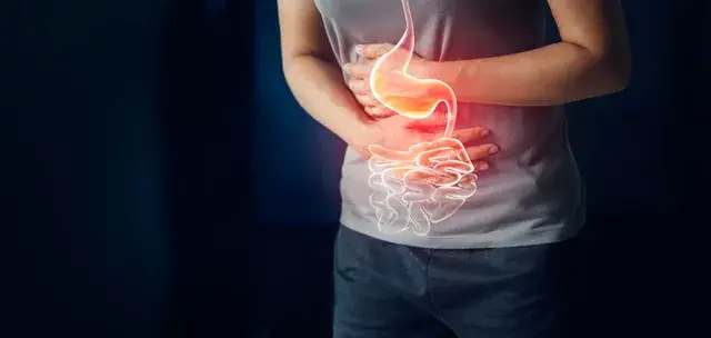 Woman touching stomach painful suffering from stomachache causes